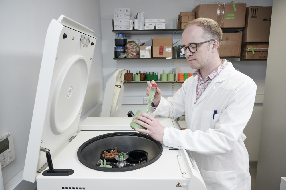Professor Stephen Wallace harvesting engineered bacteria for analysis. Professor Stephen Wallace harvesting engineered bacteria for analysis.